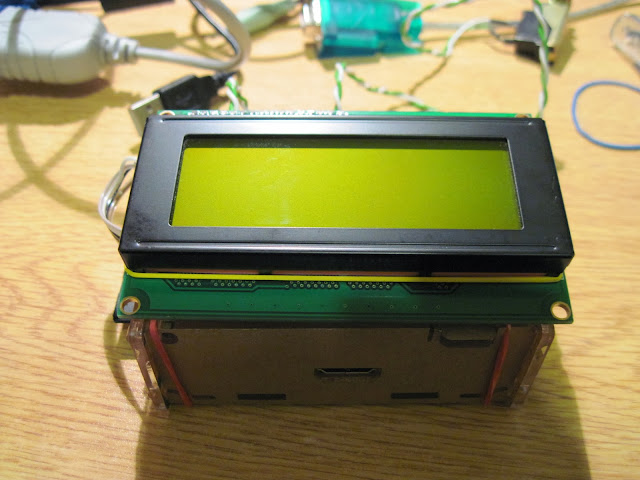 R-Pi in case with LCD attached on top with the rubber bands.